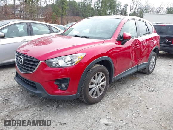 2016 Mazda CX-5 Touring z VIN JM3KE2CY3G0894441, wystawiony jako IAAI lot #41508767 z przebiegiem 88 554 mil mil oraz . Historia ofert i sprzedaży dostępna na DreamBid. Obrazek 21.