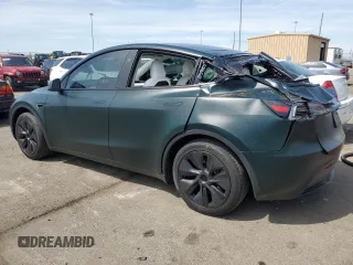 2024 Tesla Model Y z VIN 7SAYGDED4RF206585, wystawiony jako Copart lot #54161715 z przebiegiem 4 228 mil mil oraz Szkoda całkowita • Salvage title. Historia ofert i sprzedaży dostępna na DreamBid. Obrazek 2.