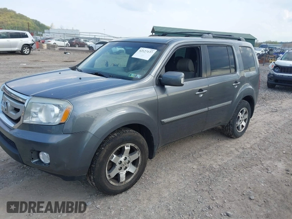 2011 Honda Pilot Touring with VIN 5FNYF4H90BB103824, listed as a IAAI auction lot 42127137 with 243,858 mi miles and . Bid and sale history available at carsss.com. Image 17.