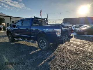 2017 Nissan Titan XD PRO-4X with VIN 1N6BA1F4XHN506954, listed as a Copart auction lot 86863864 with 61,741 mi miles and Clean Title. Bid and sale history available at carsss.com. Image 2.