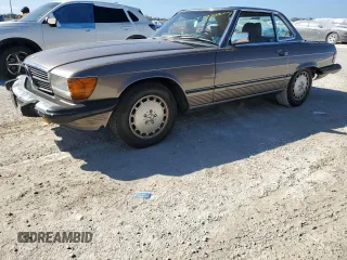 1987 Mercedes-Benz 560 with VIN WDBBA48D7HA063380, listed as a Copart auction lot 77820004 with 81,187 mi miles and Salvage Title. Bid and sale history available at carsss.com. Image 1.