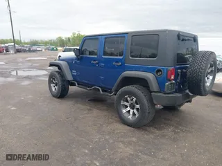 2010 Jeep Wrangler Unlimited Sport with VIN 1J4BA3H11AL144560, listed as a IAAI auction lot 42013032 with 226,233 mi miles. Bid and sale history available at carsss.com. Image 3.