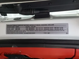 2022 Bentley Bentayga V8 z VIN SJAAM2ZV6NC039590, wystawiony jako Copart lot #85567404 z przebiegiem Nie podano mil oraz Szkoda całkowita • Salvage title. Historia ofert i sprzedaży dostępna na DreamBid. Obrazek 13.