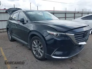 2018 Mazda CX-9 Grand Touring with VIN JM3TCADY3J0205878, listed as a IAAI auction lot 42178507 with 243,703 mi miles and . Bid and sale history available at DreamBid. Image 1.