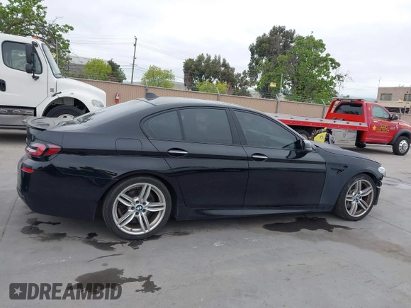 2014 BMW 5 Series 535d with VIN WBAXA5C59ED690375, listed as a IAAI auction lot 42030902 with 70,553 mi miles and . Bid and sale history available at carsss.com. Image 13.