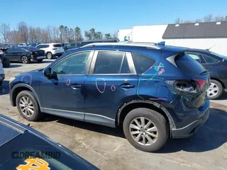 2016 Mazda CX-5 Touring with VIN JM3KE4CY0G0631786, listed as a IAAI auction lot 41761214 with 220,058 mi miles. Bid and sale history available at carsss.com. Image 14.