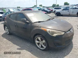 2013 Hyundai Veloster w/Black Int with VIN KMHTC6AD0DU180177, listed as a IAAI auction lot 42672121 with 178,744 mi miles and . Bid and sale history available at DreamBid. Image 1.