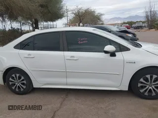 2021 Toyota Corolla Hybrid LE with VIN JTDEAMDE6MJ008815, listed as a IAAI auction lot 41586643 with 7,548 mi miles. Bid and sale history available at carsss.com. Image 13.