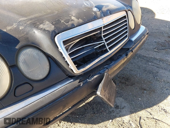 1997 Mercedes-Benz E-Class with VIN WDBJF55F6VJ032691, listed as a IAAI auction lot 40807926 with 215,262 mi miles. Bid and sale history available at carsss.com. Image 6.