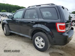 2012 Ford Escape XLS with VIN 1FMCU9C71CKA30319, listed as a Copart auction lot 60189745 with 214,736 mi miles and Salvage title. Bid and sale history available at DreamBid. Image 2.