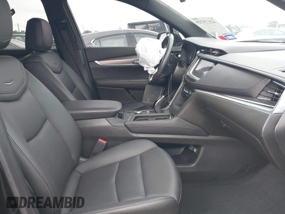 2023 Cadillac XT6 FWD Luxury z VIN 1GYKPAR43PZ147512, wystawiony jako IAAI lot #42175720 z przebiegiem 31 520 mil mil oraz . Historia ofert i sprzedaży dostępna na DreamBid. Obrazek 5.