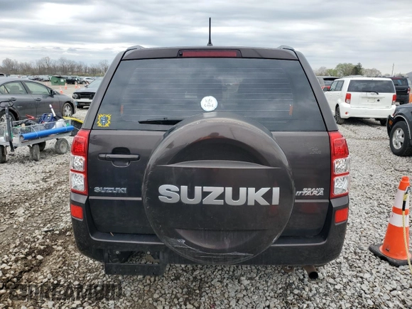 2013 Suzuki Grand Vitara z VIN JS3TE0D44D4100033, wystawiony jako Copart lot #51648665 z przebiegiem 151 879 mil mil oraz Czysty tytuł • Clean title. Historia ofert i sprzedaży dostępna na DreamBid. Obrazek 6.