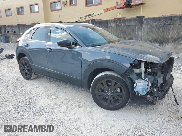 2021 Mazda CX-30 Premium with VIN 3MVDMBDY2MM306250, listed as a Copart auction lot 53430615 with 59,112 mi miles and Salvage title. Bid and sale history available at DreamBid. Image 4.