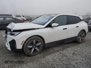2023 BMW iX xDrive50 with VIN WB523CF04PCL67044, listed as a Copart auction lot 82805014 with 12,858 mi miles and Salvage Title. Bid and sale history available at carsss.com. Image 1.