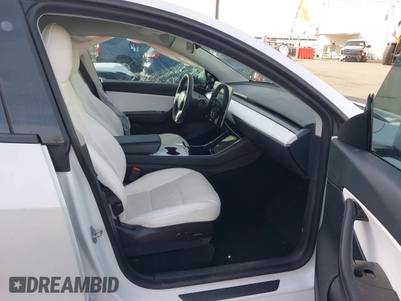 2021 Tesla Model Y Long Range with VIN 5YJYGDEE3MF098586, listed as a IAAI auction lot 40939802 with Not Provided miles and . Bid and sale history available at DreamBid. Image 5.