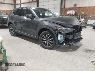 2018 Mazda CX-5 Grand Touring z VIN JM3KFBDM9J0315680, wystawiony jako IAAI lot #42007252 z przebiegiem 27 484 mil mil oraz . Historia ofert i sprzedaży dostępna na DreamBid. Obrazek 1.