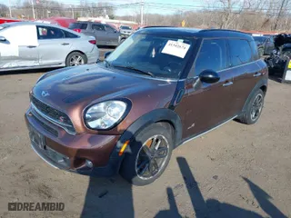 2015 MINI Cooper Countryman S with VIN WMWZC5C55FWP47826, listed as a IAAI auction lot 41342674 with 94,683 mi miles. Bid and sale history available at carsss.com. Image 2.