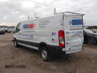 2023 Ford Transit Cargo with VIN 1FTYE1Y82PKB92413, listed as a IAAI auction lot 41702808 with 20,144 mi miles and . Bid and sale history available at DreamBid. Image 3.