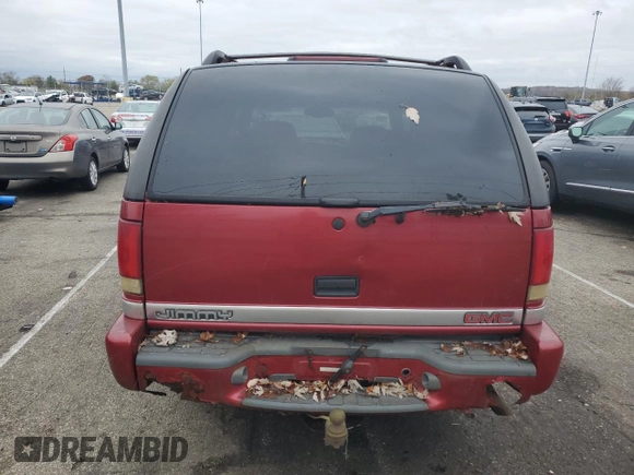 1999 GMC Jimmy SLE z VIN 1GKDT13W3X2546163, wystawiony jako Copart lot #79842734 z przebiegiem 144 800 mil mil oraz Szkoda całkowita • Salvage title. Historia ofert i sprzedaży dostępna na DreamBid. Obrazek 6.