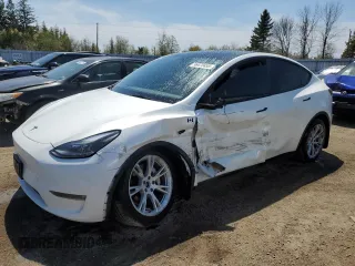 2023 Tesla Model Y Long Range z VIN 7SAYGDEE3PF772663, wystawiony jako Copart lot #56470455 z przebiegiem 50 705 mil mil oraz Czysty tytuł • Clean title. Historia ofert i sprzedaży dostępna na DreamBid. Obrazek 1.