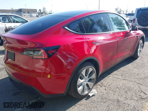 2020 Tesla Model Y Long Range with VIN 5YJYGDEE8LF057014, listed as a IAAI auction lot 41988113 with 18,246 mi miles and . Bid and sale history available at DreamBid. Image 4.