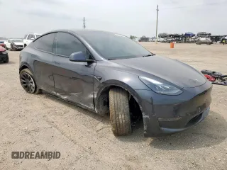 2024 Tesla Model Y Long Range with VIN 7SAYGDEE2RA287446, listed as a Copart auction lot 57640895 with 27,932 mi miles and Salvage title. Bid and sale history available at DreamBid. Image 4.