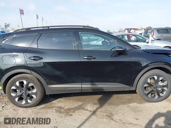 2023 Kia Sportage Plug-In Hybrid X-Line with VIN KNDPYDAH9P7027170, listed as a IAAI auction lot 41583963 with 15,276 mi miles. Bid and sale history available at carsss.com. Image 14.