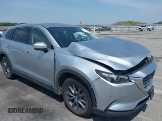 2020 Mazda CX-9 Touring with VIN JM3TCBCY2L0415513, listed as a IAAI auction lot 42481543 with 47,294 mi miles and . Bid and sale history available at DreamBid. Image 1.
