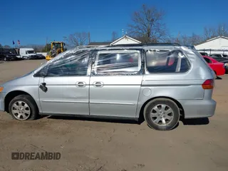 2004 Honda Odyssey EX-L with VIN 5FNRL18924B107971, listed as a IAAI auction lot 41699067 with Not Provided miles and . Bid and sale history available at DreamBid. Image 13.