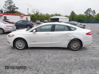 2014 Ford Fusion SE Hybrid with VIN 3FA6P0LU3ER312041, listed as a IAAI auction lot 41964588 with 138,566 mi miles and . Bid and sale history available at DreamBid. Image 14.