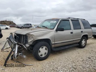 1999 GMC Yukon with VIN 1GKEK13R5XJ767903, listed as a Copart auction lot 84158844 with 112,229 mi miles and Salvage Title. Bid and sale history available at carsss.com. Image 1.