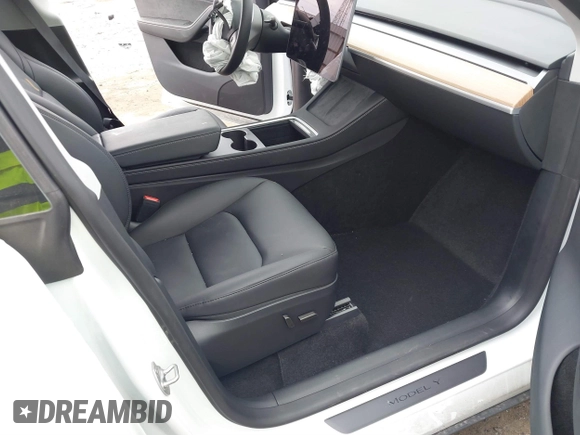 2024 Tesla Model Y Performance with VIN 7SAYGDEF4RA278532, listed as a IAAI auction lot 41511769 with 9,487 mi miles and . Bid and sale history available at DreamBid. Image 5.