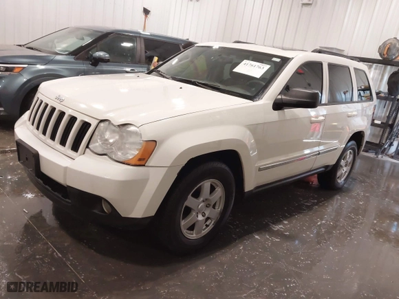 2010 Jeep Grand Cherokee Laredo with VIN 1J4PR4GK1AC143486, listed as a IAAI auction lot 41761763 with 159,139 mi miles. Bid and sale history available at carsss.com. Image 18.