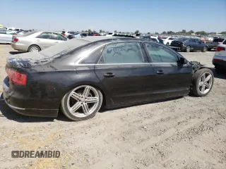 2013 Audi A8 3.0L with VIN WAURGAFD9DN004556, listed as a Copart auction lot 65018975 with 138,090 mi miles and Salvage title. Bid and sale history available at DreamBid. Image 3.