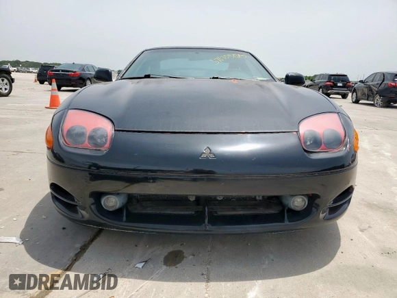 1999 Mitsubishi 3000GT z VIN JA3AM44H6XY002443, wystawiony jako Copart lot #57155505 z przebiegiem 201 588 mil mil oraz Czysty tytuł • Clean title. Historia ofert i sprzedaży dostępna na DreamBid. Obrazek 5.