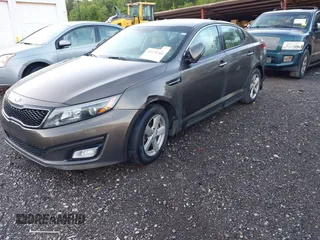 2015 Kia Optima LX z VIN 5XXGM4A79FG397995, wystawiony jako IAAI lot #42175785 z przebiegiem 159 239 mil mil oraz . Historia ofert i sprzedaży dostępna na DreamBid. Obrazek 2.