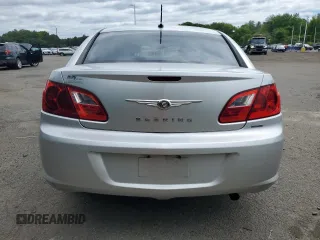 2010 Chrysler Sebring Touring z VIN 1C3CC4FB3AN203543, wystawiony jako Copart lot #57767985 z przebiegiem 152 951 mil mil oraz Szkoda całkowita • Salvage title. Historia ofert i sprzedaży dostępna na DreamBid. Obrazek 6.