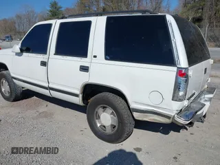 1999 GMC Yukon with VIN 1GKEK13R8XJ763098, listed as a IAAI auction lot 41753745 with 209,451 mi miles. Bid and sale history available at carsss.com. Image 3.