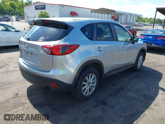 2016 Mazda CX-5 Touring z VIN JM3KE4CY4G0646114, wystawiony jako IAAI lot #42269181 z przebiegiem 58 252 mil mil oraz . Historia ofert i sprzedaży dostępna na DreamBid. Obrazek 4.
