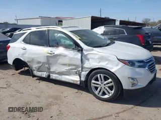 2018 Chevrolet Equinox Premier with VIN 2GNAXWEX3J6141427, listed as a IAAI auction lot 41830179 with 76,707 mi miles and . Bid and sale history available at carsss.com. Image 1.