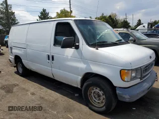 1999 Ford Econoline Cargo with VIN 1FTRE1429XHA29986, listed as a Copart auction lot 70331004 with 312,901 mi miles and Non Repairable. Bid and sale history available at carsss.com. Image 4.