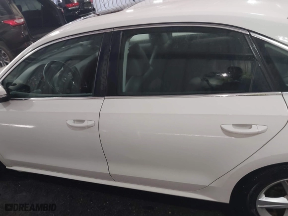 2013 Volkswagen Passat SE w/Sunroof with VIN 1VWBH7A35DC111003, listed as a IAAI auction lot 41991990 with 142,103 mi miles. Bid and sale history available at carsss.com. Image 14.