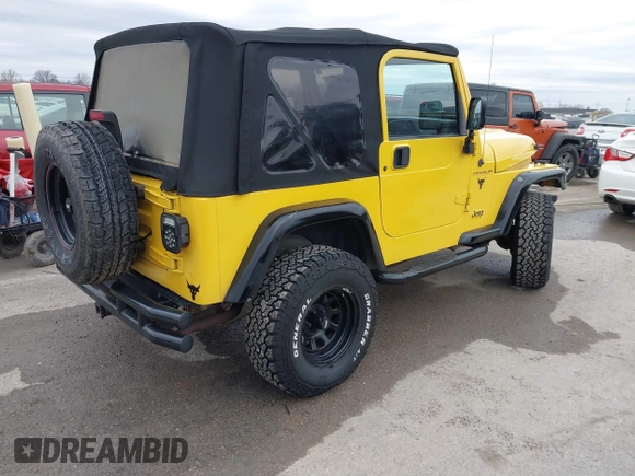 2000 Jeep Wrangler SE with VIN 1J4FA29P2YP797156, listed as a IAAI auction lot 41517183 with 114,236 mi miles. Bid and sale history available at carsss.com. Image 4.