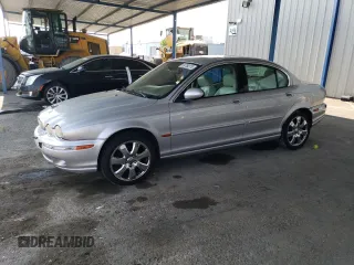 2004 Jaguar X-Type z VIN SAJEA51C44WD88303, wystawiony jako Copart lot #59709275 z przebiegiem 216 787 mil mil oraz Szkoda całkowita • Salvage title. Historia ofert i sprzedaży dostępna na DreamBid. Obrazek 1.