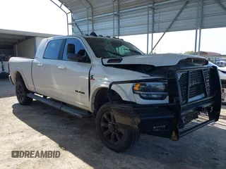 2021 Ram 2500 Laramie with VIN 3C6UR5NLXMG677847, listed as a IAAI auction lot 40992410 with 106,912 mi miles. Bid and sale history available at carsss.com. Image 1.