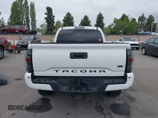 2021 Toyota Tacoma SR5 z VIN 3TMDZ5BN2MM100245, wystawiony jako IAAI lot #42078914 z przebiegiem 58 153 mil mil oraz . Historia ofert i sprzedaży dostępna na DreamBid. Obrazek 17.