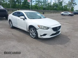 2014 Mazda 6 i Touring with VIN JM1GJ1V64E1142643, listed as a IAAI auction lot 42229322 with 215,095 mi miles and . Bid and sale history available at DreamBid. Image 1.