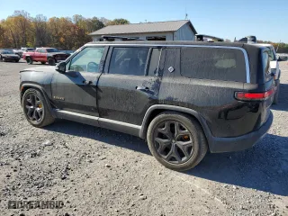 2022 Rivian R1S Launch Edition with VIN 7PDSGABL6NN001531, listed as a Copart auction lot 77143684 with 27,241 mi miles and Salvage Title. Bid and sale history available at carsss.com. Image 2.