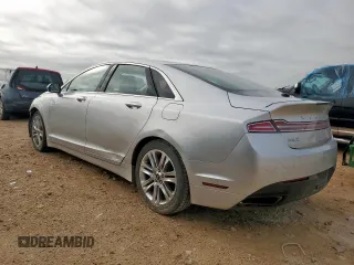 2014 Lincoln MKZ z VIN 3LN6L2G90ER815819, wystawiony jako Copart lot #61189515 z przebiegiem 101 148 mil mil oraz Szkoda całkowita • Salvage title. Historia ofert i sprzedaży dostępna na DreamBid. Obrazek 2.