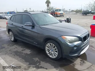 2013 BMW X1 28i with VIN WBAVM1C55DVW41609, listed as a IAAI auction lot 41604038 with 126,036 mi miles. Bid and sale history available at carsss.com. Image 1.